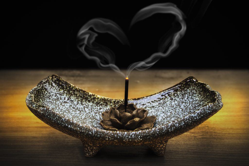 Incense On Stand Burning, Smoke Forming Heart