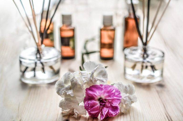 Aromatherapy Setup On Table With Flowers