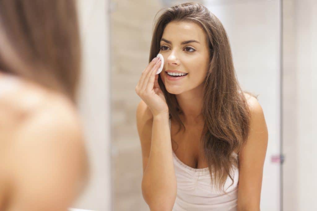 Brunette Woman Removing Makeup