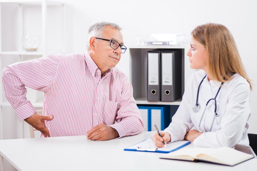 Doctor And Patient Having Conversation