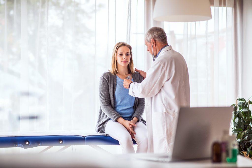 Senior Doctor Examining A Young Woman In Office P7Az6Bt 1024X683 1 - Essential Oils For Sinus Infection